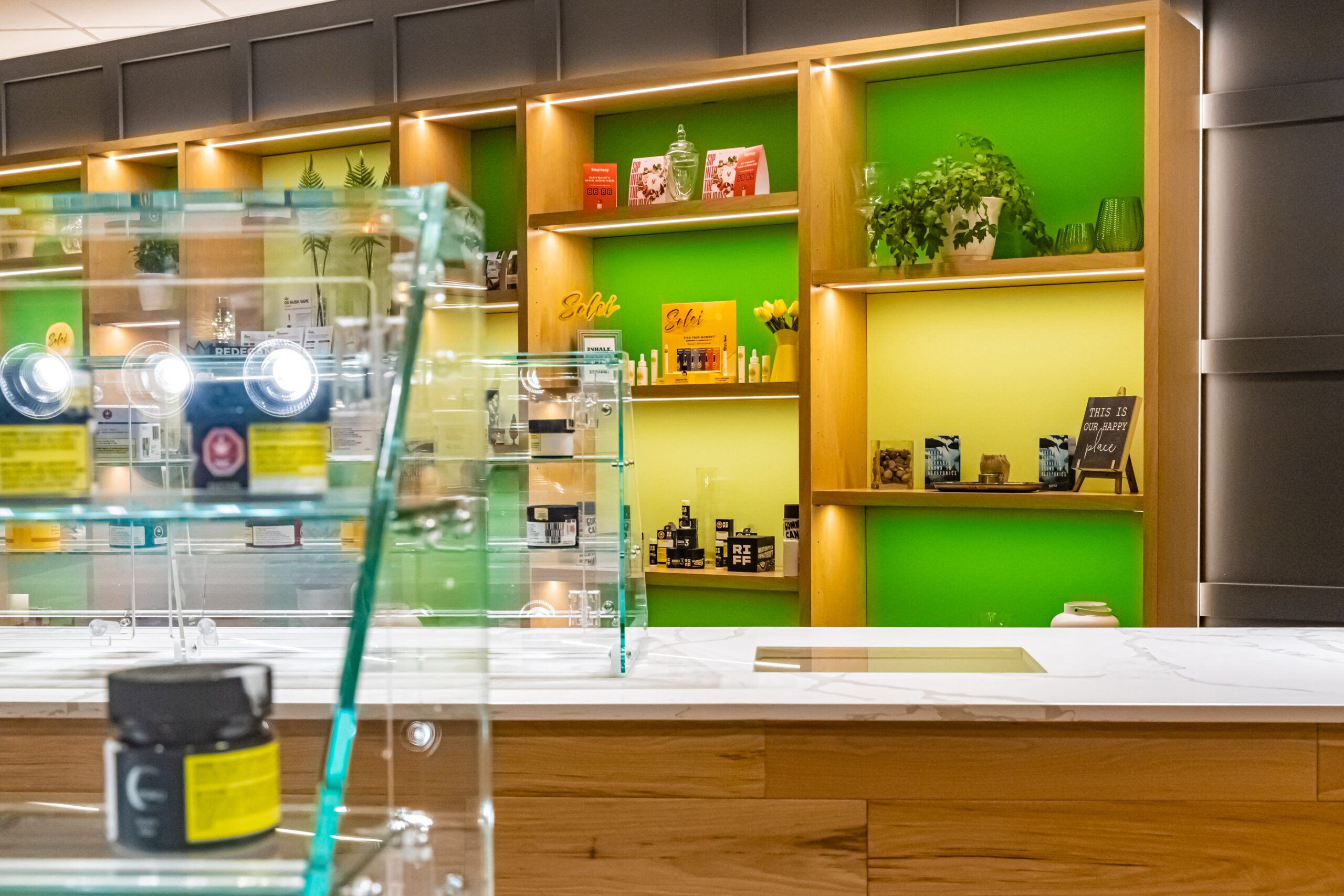 Product shelves featuring cannabis oils, edibles, and accessories at Chamba Cannabis Co. Waterloo store
